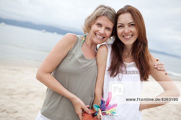 Two happy women on beach  Brazil