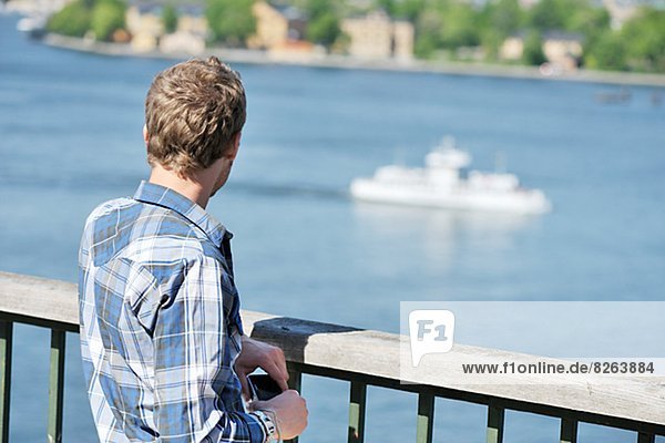 A young man looking at Stockholm  Sweden.