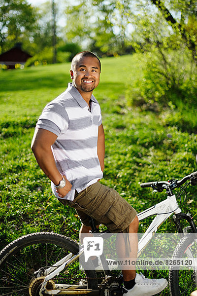 Smiling man on bicycle