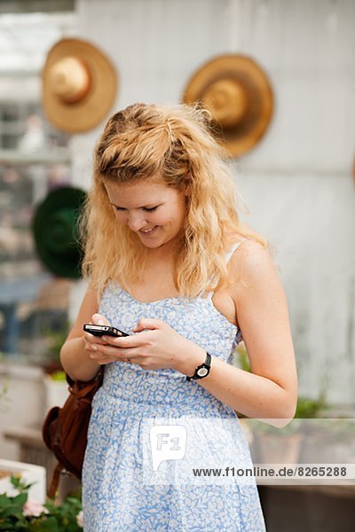 Smiling woman texting