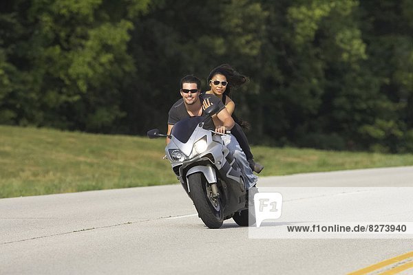 Young couple ridding on a motorcycle in Kansas