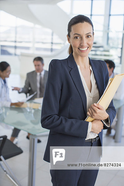 Portrait of smiling businesswoman in meeting
