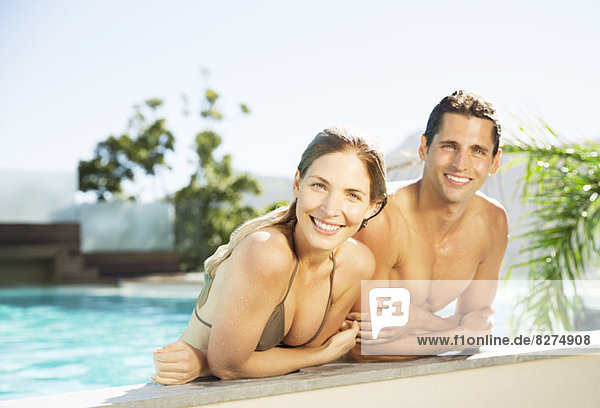 Couple relaxing in swimming pool
