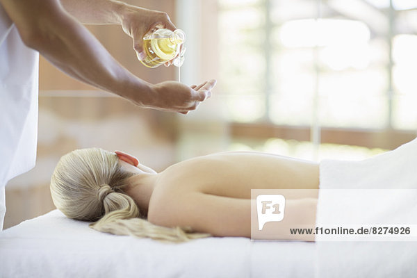 Woman receiving massage at spa
