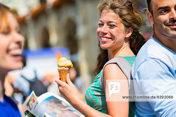 Woman eating ice cream  smiling