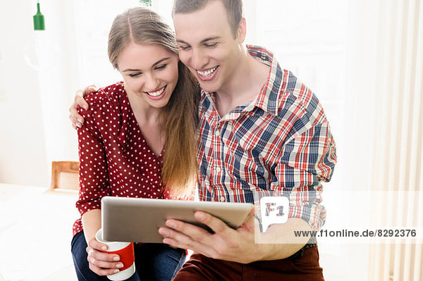 Couple on video chat using digital tablet