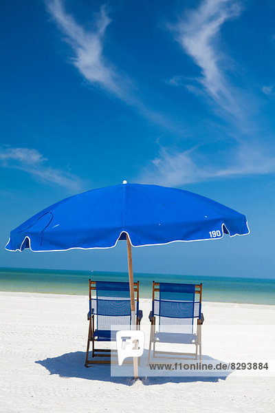 Deckchairs and parasol on beach  Clearwater  Florida  United States