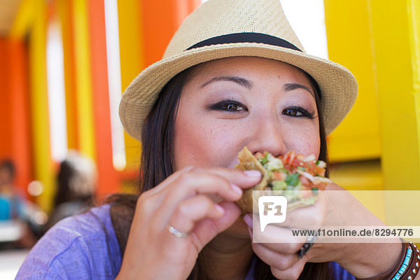Woman eating Lebanese bread wrap