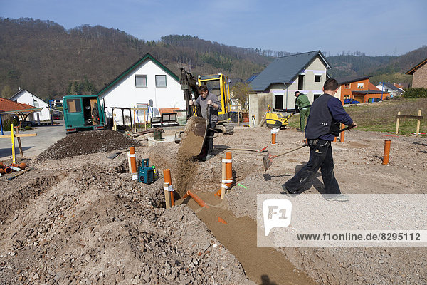 Germany  Rhineland-Palatinate  house building  earth works  laying pipes