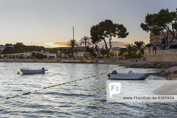 Spain  Ibiza  Beach of Es Canar during sunset