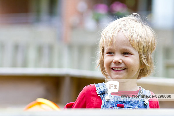 portrait of smiling little girl at playground