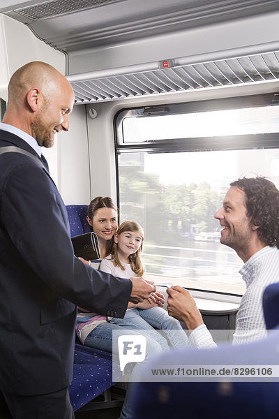 Conductor and family in a train