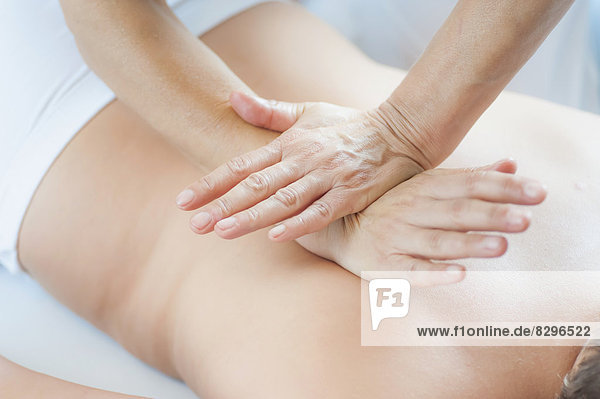 Traditional Chinese Medicine  TCM  female therapist during Tuina massage