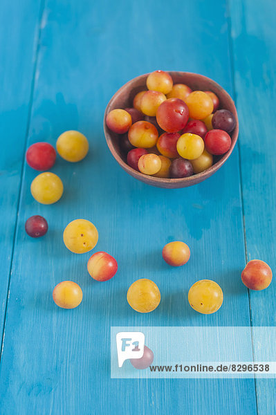Mirabelles in and around a bowl
