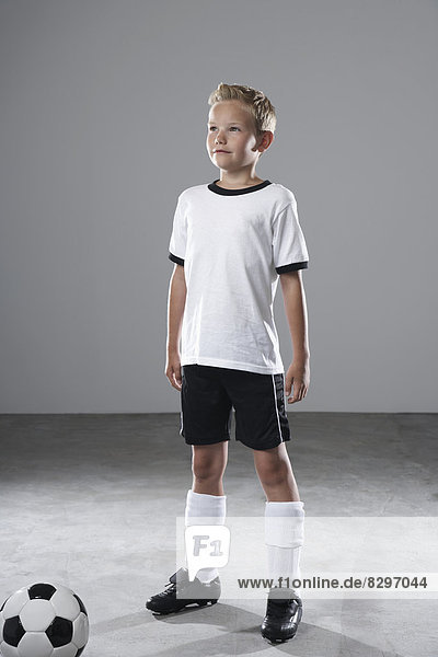 Boy in soccer jersey with ball