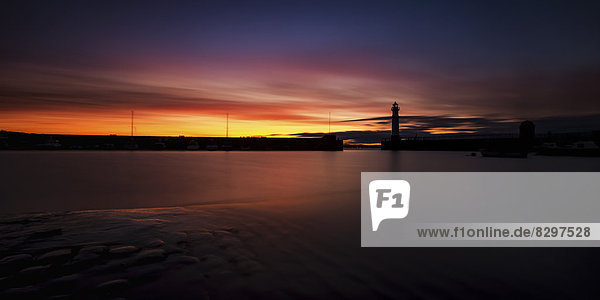 UK  Scotland  Edinburgh  Newhaven Harbour with lighthouse at sunset