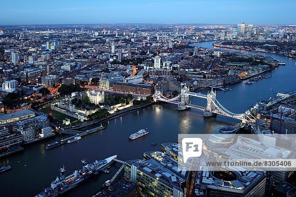 Aerial view of London at night with the Tower Bridge in the foreground  England  Great Britain  United Kingdom  Europe.