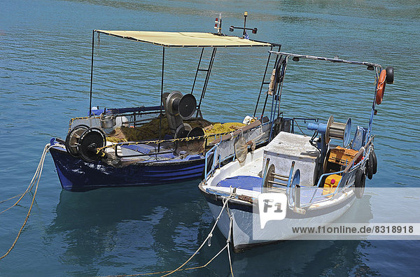 Two small fishing boats in the harbour