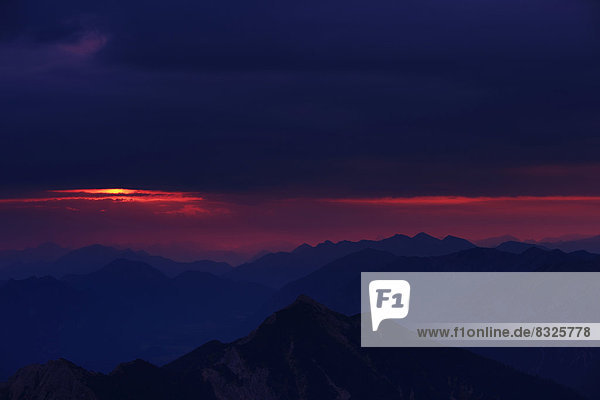 Sunrise over the Ammer Mountains with a dramatic sky