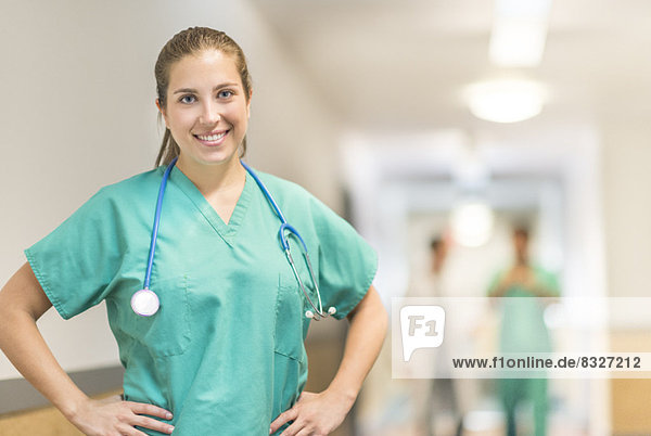 Portrait of female doctor in hospital hallway