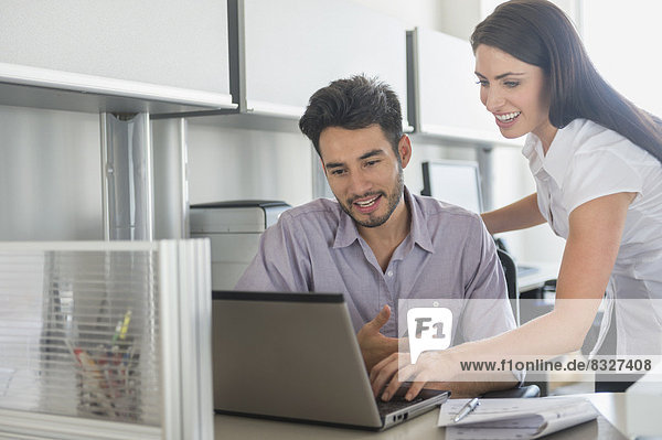 Business man and woman at work in office