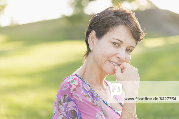 Portrait of mature woman smiling outdoors