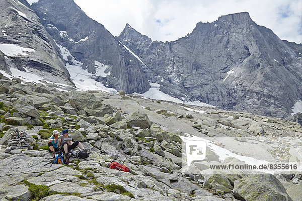 Two hikers having a break in Val Bondasca  Bergell  Grisons  Switzerland
