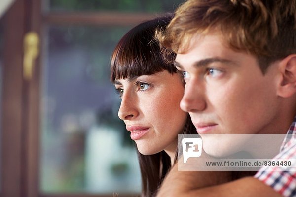 Portrait of couple looking away  close up