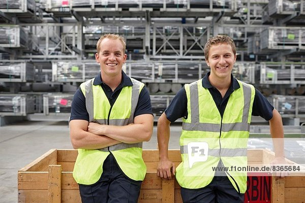 Portrait of warehouse workers in engineering warehouse