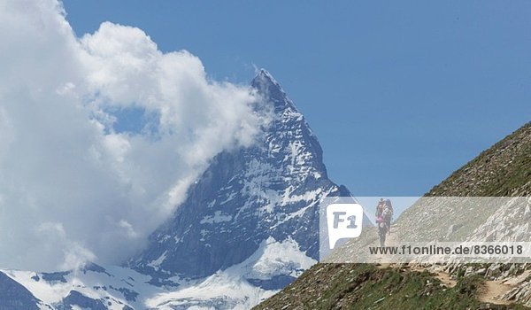 Man hiking towards the Matterhorn  Zermatt  Canton Wallis  Switzerland