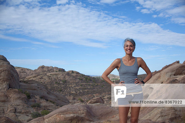 Woman standing at Vazquez Rocks with hands on hips