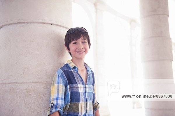 Portrait of boy wearing blue checked shirt