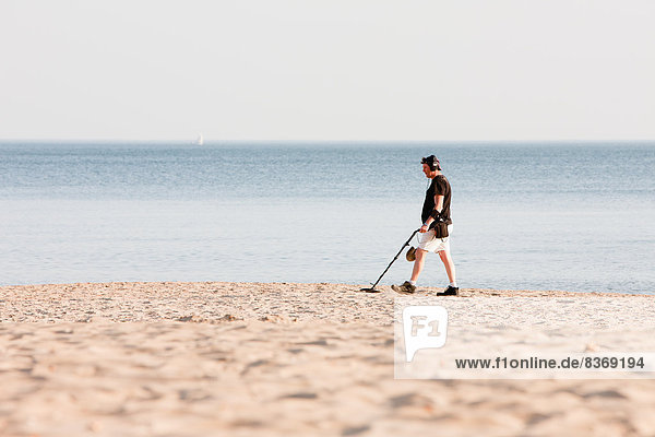 Man Using Metal Detector On Beach Bournemouth  Dorset  England  Uk