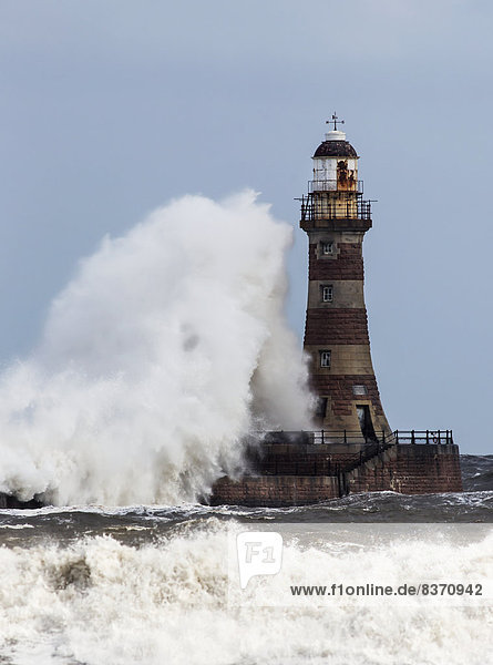 A Large Wave Crashing Into A Lighthouse Sunderland  Tyne And Wear  England