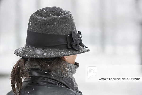 A Woman Wearing A Hat In A Snowfall Locarno  Ticino  Switzerland