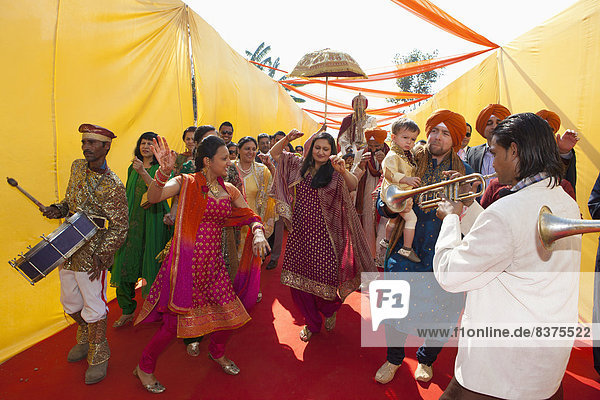 Family And Friends Greet The Groom At An Indian Wedding  Ludhiana  Punjab  India