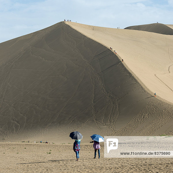 Tourists On Singing Sand Mountain  Jiuquan  Gansu  China