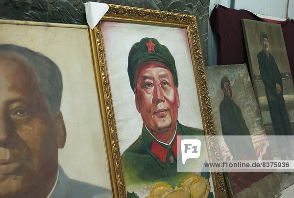 Old Photographs Of Chinese Leaders Displayed In A Row At Panjiayuan Antique Market  Beijing  China