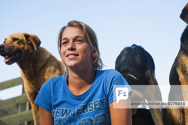A Young Woman With Sheep Dogs At Blue Duck Lodge  In The Whanganui National Park  Whanganui  New Zealand