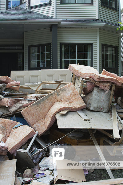 Garbage And Destroyed Household Items Piled Outside A Home After A Flood  Calgary  Alberta  Canada