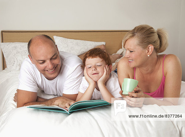 Family Reading Together In Bed  San Francisco  California  Canada