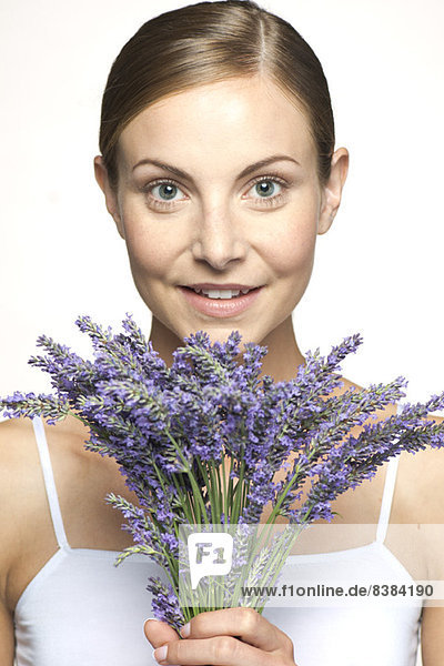 Woman holding bouquet of fresh lavender  portrait