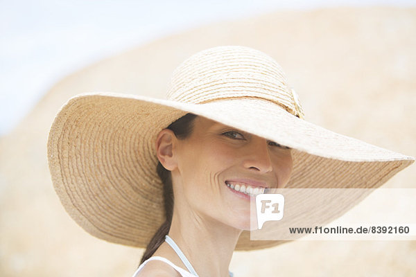 Woman wearing straw hat outdoors