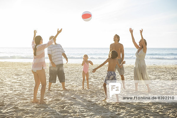 Family playing together on beach
