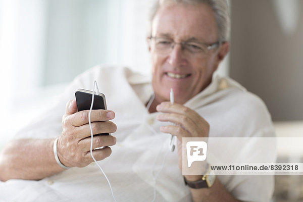 Older man using cell phone