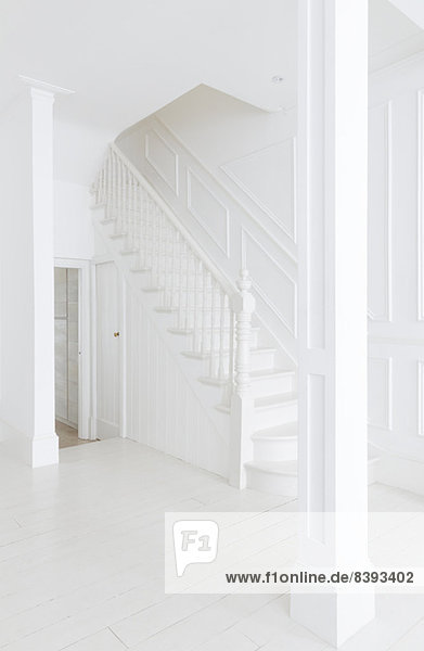 Staircase in white foyer