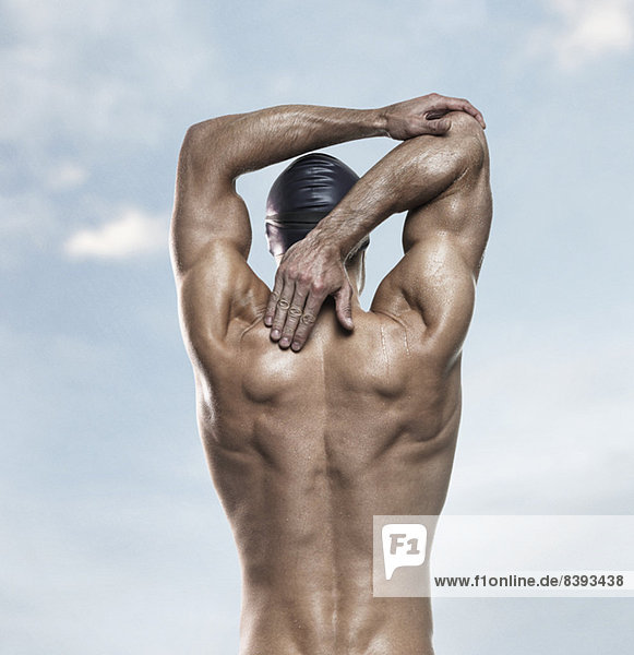 Swimmer stretching outdoors