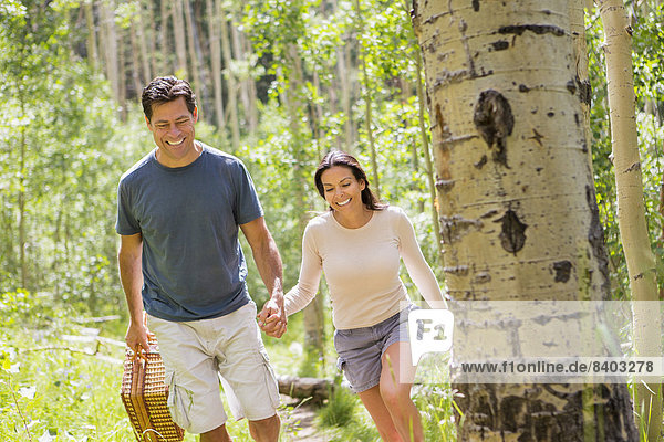 Couple walking together in forest