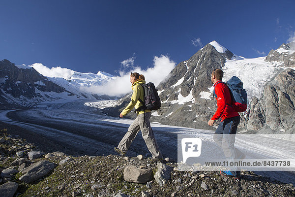 Switzerland  Europe  mountain  mountains  canton  Valais  glacier  ice  moraine  man  woman  couple  walking  hiking  Glacier de Combassiere  Grand Combin