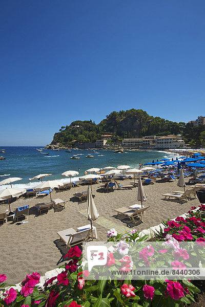 Sicily Italy South Italy Europe island Mazzaro bay Taormina province Messina beach seashore coast Mediterranean Sea sea sunshades outside day